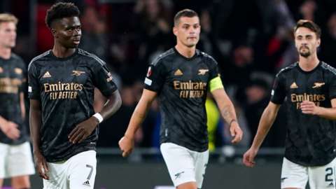 Arsenal's players react to conceding a goal against PSV Eindhoven in the Europa League