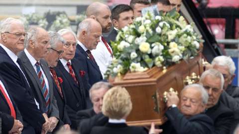 Pallbearers and a guard of honour at Phil Bennett's memorial service