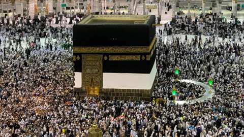 Hajj pilgrims circumambulate around the Kaaba, Islam's holiest site