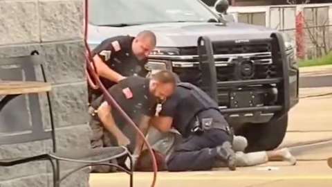 The officers were suspended after the video emerged showing a a suspect being repeatedly hit.