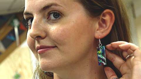 Woman wearing recycled plastic earring