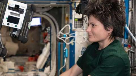 Samantha Cristoforetti working at the International Space Station