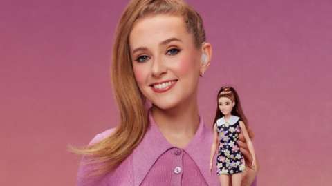 Rose Ayling-Ellis holding barbie doll
