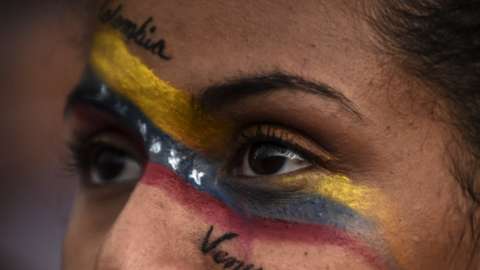 Venezuelans opposed to President Nicolas Maduro hold a demonstration in Medellin, Colombia in support of opposition leader Juan Guaido's self-proclamation as acting president of Venezuela, on January 23, 2019. (
