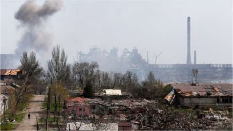 Smoke rises above a plant of Azovstal Iron and Steel Works company and buildings damaged in the course of Ukraine-Russia conflict in the southern port city of Mariupol, Ukraine 18 April 2022