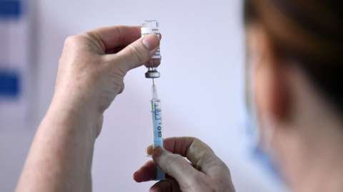 Medical staff member prepares a shot of a Covid-19 vaccine at Belfast's SSE Arena