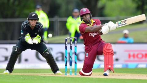 New Zealand wicketkeeper Tom Latham and West Indies' Rovman Powell