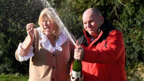 Ian and Sandra Black with champagne