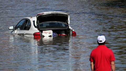 A car submerged in flood waters from Hurricane Ida