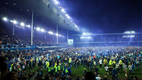 Fans invade the pitch at full time at Goodison Park after Everton's win over Crystal Palace