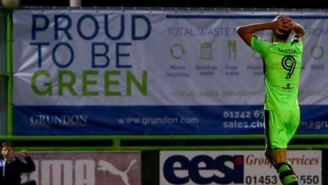 A sign at Forest Green says 'Proud to be Green'