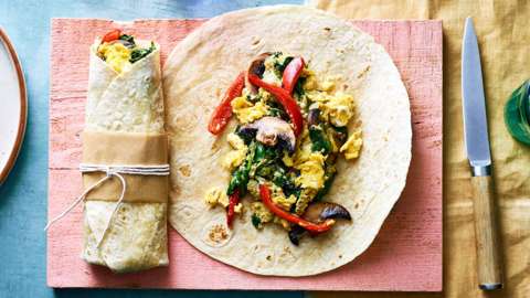 Aerial shot of a wrap filled with scrambled eggs and vegetables
