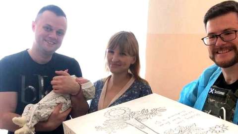 New parents in Ukraine with their new baby and baby box