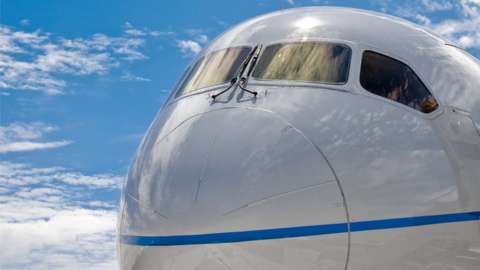 Close-up of the nose of a Boeing 787 Dreamliner commercial jet airliner