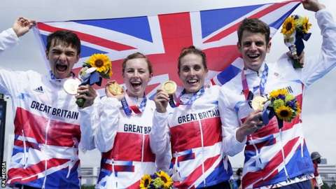 Great Britain celebrate winning the inaugural Olympic triathlon mixed relay event