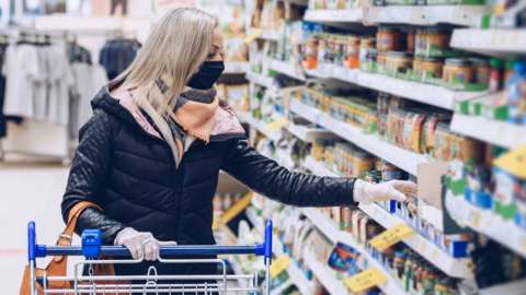 Stock image of a woman in a supermarket