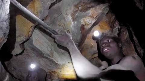 Miner digging for gold