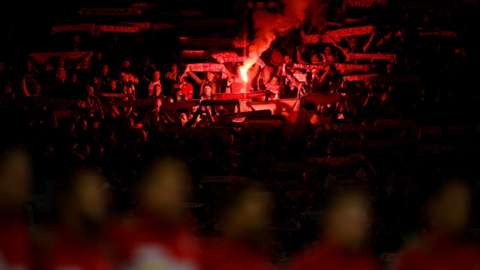 Flares among Poland fans at the Cardiff City Stadium