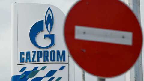 Gazprom logo with a stop sign in front