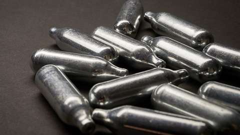 Nitrous oxide is sold in metal canisters often discarded in the street