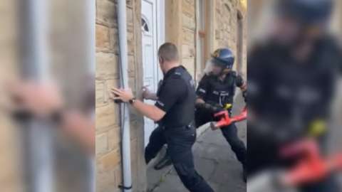 Lancashire Police entering home to execute arrests