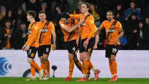 Tom Eaves celebrates his goal with his Hull team-mates