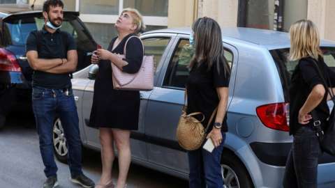 Locals get out on the street following an earthquake in Heraklion on the island of Crete, Greece, September 27, 2021.