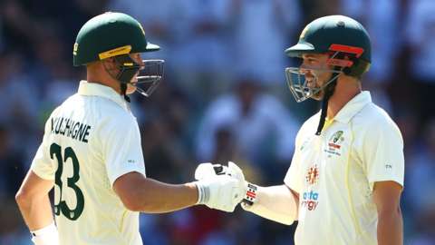 Travis Head of Australia celebrates with Marnus Labuschagne of Australia after reaching 150 runs during day two of the Second Test Match in the series between Australia and the West Indies at Adelaide Oval on December 09, 2022