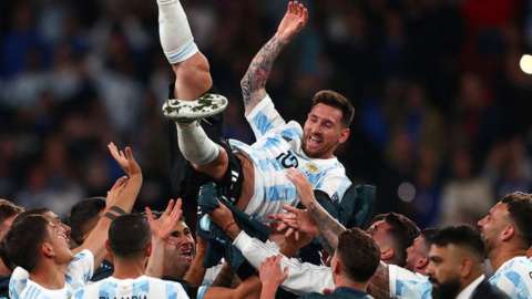 Lionel Messi lifted aloft by Argentina team-mates