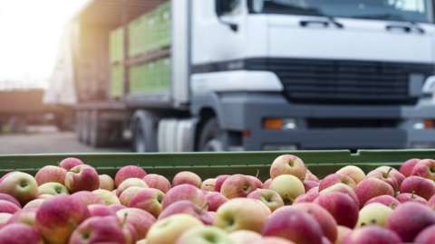 Apples being imported by truck