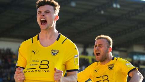Luke McNally celebrates his late equaliser for Oxford United against Ipswich
