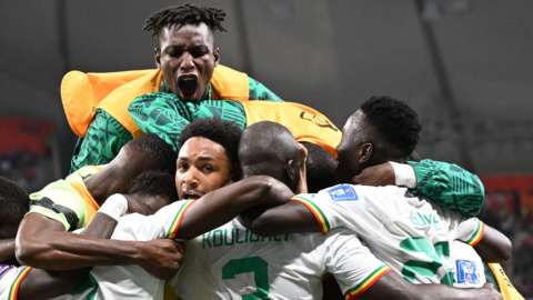 Senegal celebrate Kalidou Koulibaly's winner against Ecuador to send them into the last 16 of the World Cup