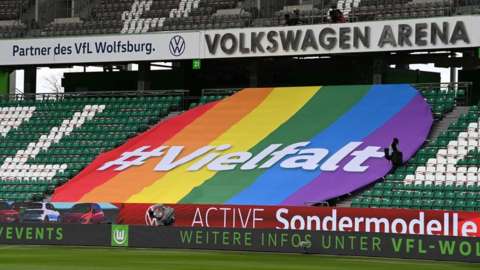 VW ad saying "diversity" at VfL Wolfsburg stadium, 13 Mar 21