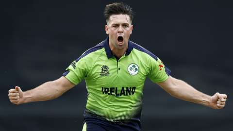 Ireland bowler Fionn Hand celebrates taking the wicket of England's Ben Stokes
