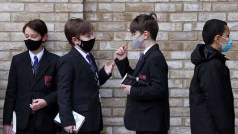Pupils at Fulham Boys' School queue to get tested