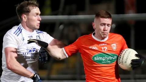 Monaghan's Niall Kearns challenges Armagh's Ross McQuillan