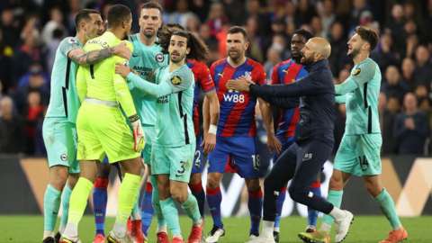 Brighton and Palace players clash