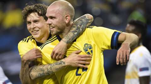 Marcus Danielson celebrates scoring for Sweden against Armenia with Victor Lindelof