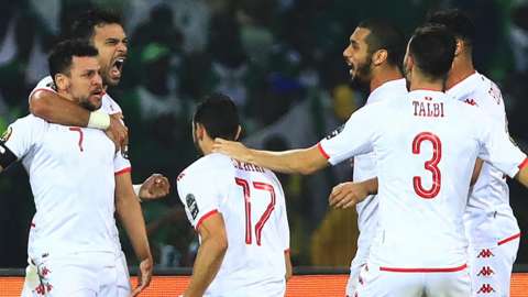 Youssef Msakni (far left) celebrates his goal for Tunisia