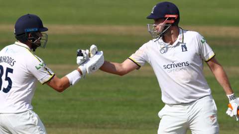 Warwickshire's Will Rhodes (left) and Dom Sibley (right)