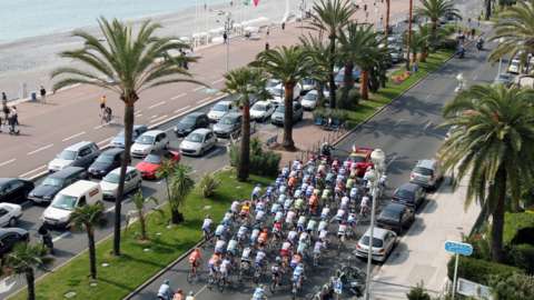 Cyclists in the Paris-Nice cycle next to the beach in Nice