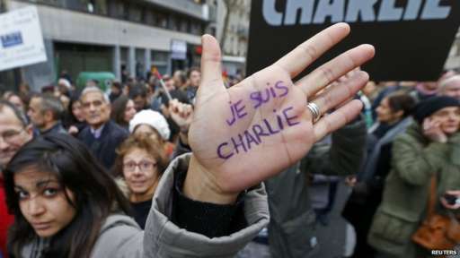 Woman with "Je Suis Charlie" written on her hand
