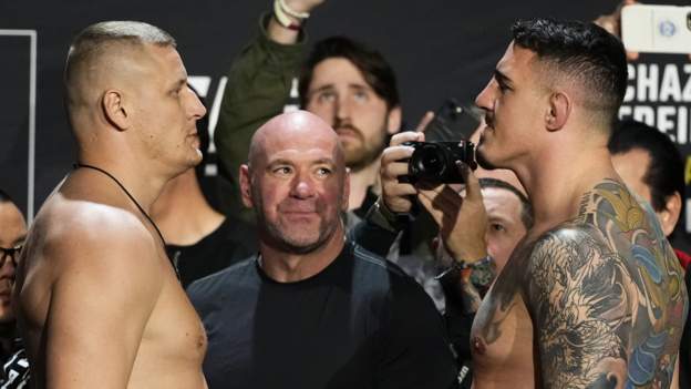 Aspinall cheered by fans at UFC title weigh-in