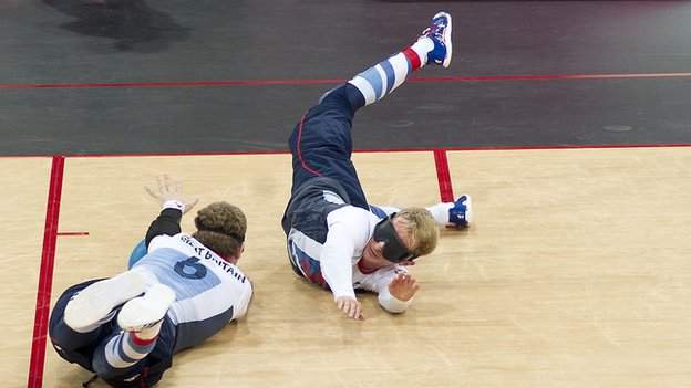 Britain's Adam Knott, Niall Graham and Michael Sharkey dive to defend their goal against Lithuania at the London 2012 Paralympics