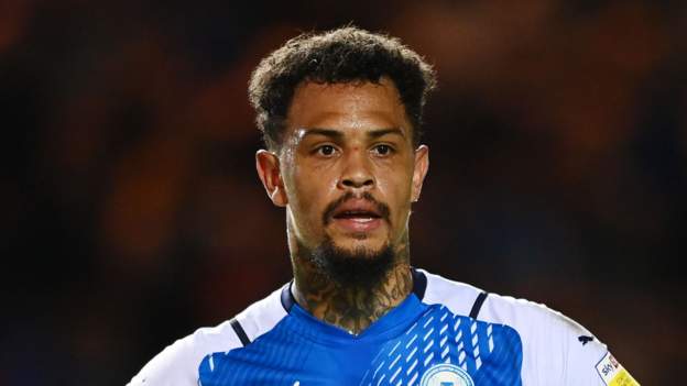 Jonson Clarke-Harris: Peterborough striker banned and fined over social media posts