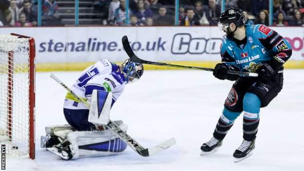 Belfast Giants' Blair Riley scoring against Coventry Blaze's Matt Hackett