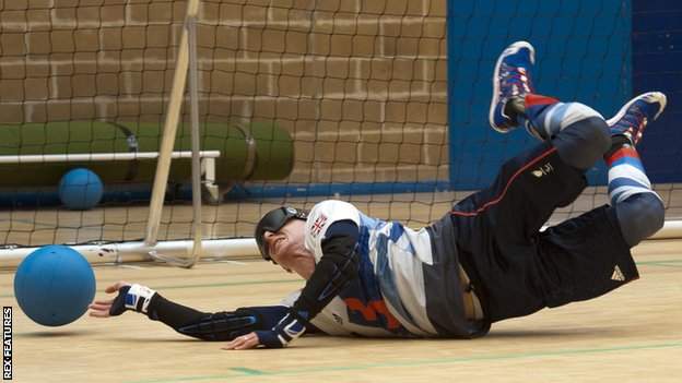 GB goalball player Michael Sharkey lunges to stop the ball