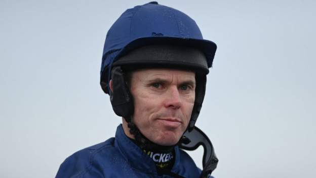 Grand National-winning jockey in intensive care after fall