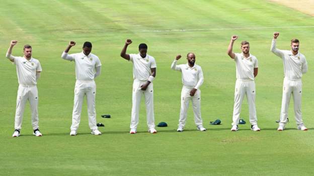 South African cricketers raise fists before match South African cricketers raise fists before match
