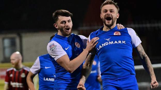 Ryan brace helps Larne go top as Carrick beat Ballymena